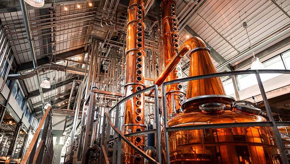 Interior of distillery with copper pot and column stills